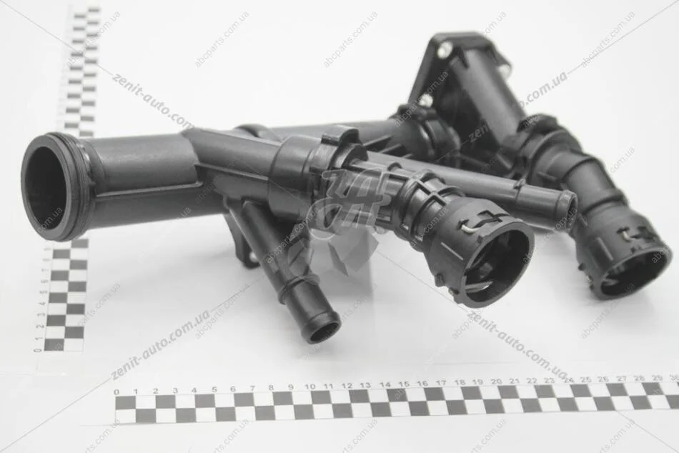 Термостат з корпусом VW Passat (13-), Polo (18-), Tiguan (16-), Golf (13-), Caddy/Audi A3 1.6D, 2.0D (17-) VAG 04L121026AH (фото 1)